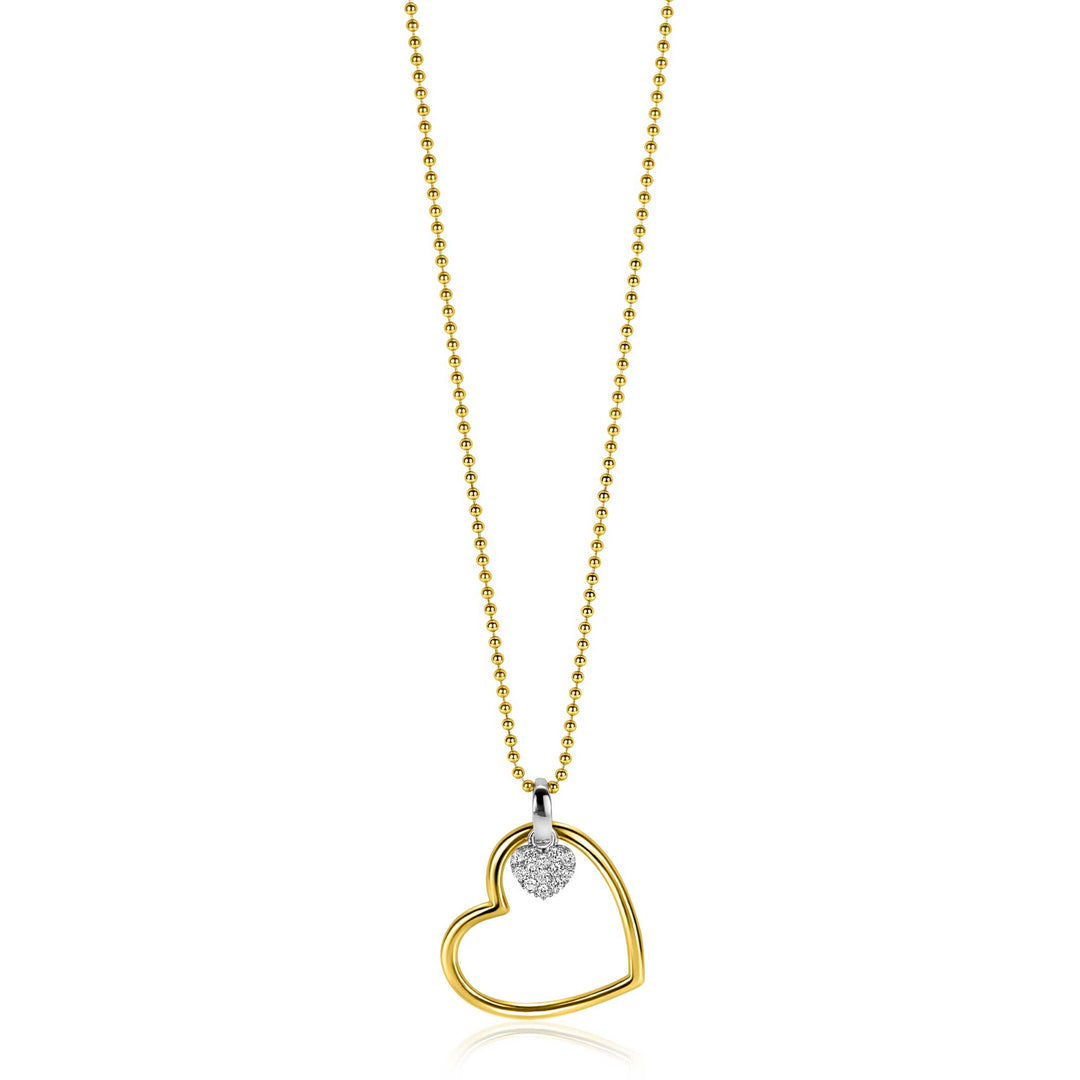 De Zinzi ketting ZIC2621 (45-48 cm) heeft een gouden kralenketting met een open harthanger en een getextureerd zilveren hart. Deze ketting combineert elegantie en contrast voor een tijdloze tweekleurige look van Zinzi.