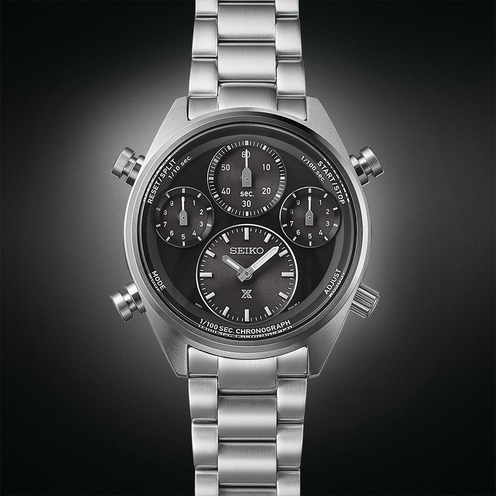 Het Seiko Prospex herenhorloge SFJ003P1 heeft een zilverkleurig ontwerp met een zwarte wijzerplaat, meerdere wijzerplaten voor de tijd en stopwatchfuncties, een metalen band, gedetailleerde markeringen op een donkere achtergrond met kleurverloop en wordt aangestuurd door Solar uurwerk voor betrouwbare prestaties.