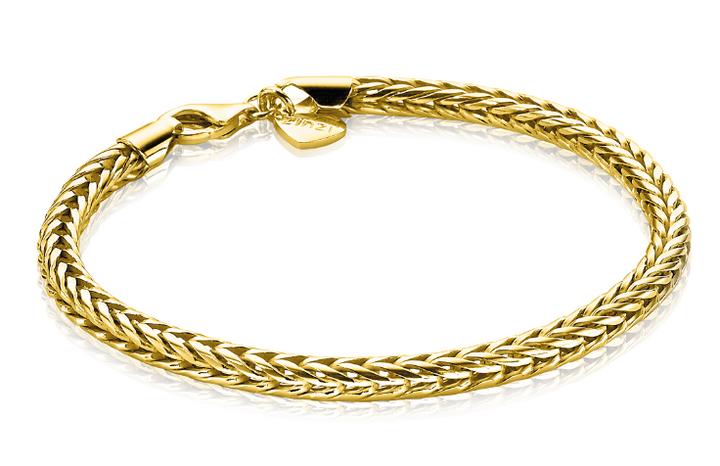 De Zinzi Armband Gold Plated Zia1925 G toont een geweven kettingontwerp met een karabijnsluiting, met een klein hartvormig bedeltje. Het 14K vergulde stuk benadrukt de ingewikkelde textuur van zijn glanzende zilveren vossenstaart armband.