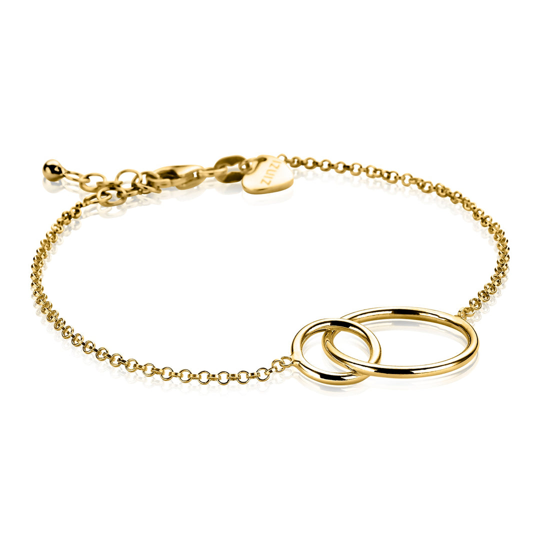 De Zinzi Armband Verguld Zia1278 G heeft twee in elkaar grijpende ringen als centraal ontwerp met een klein hartvormig bedeltje bij de sluiting, waardoor ronde vormen mooi uitkomen. Merk: Zinzi.
